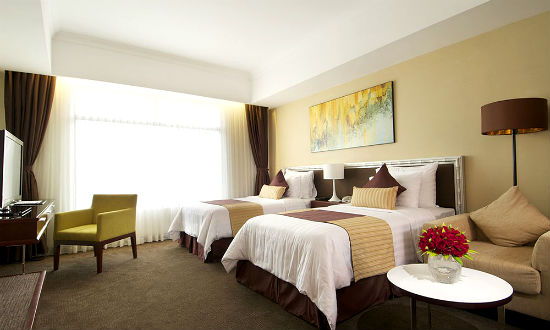 Ph&ograve;ng ngủ b&agrave;i tr&iacute; giản dị của Vissai Saigon Hotel